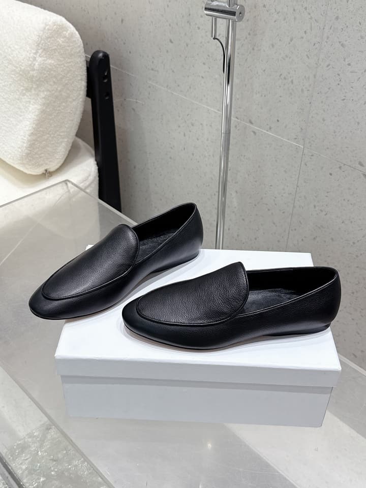 The Row Tassel Loafers in Black Suede