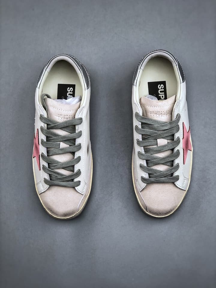 Golden Goose Distressed Sneakers in Gold