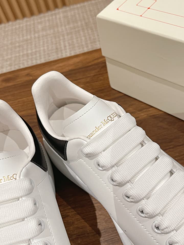 Alexander McQueen Classic Versatile White Sneakers in White With Black Laces & Heel