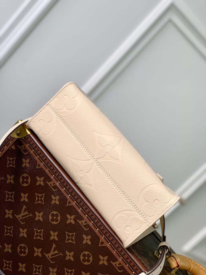Louis Vuitton OnTheGo Small Tote Bag in Cream Empreinte With Monogram Sides