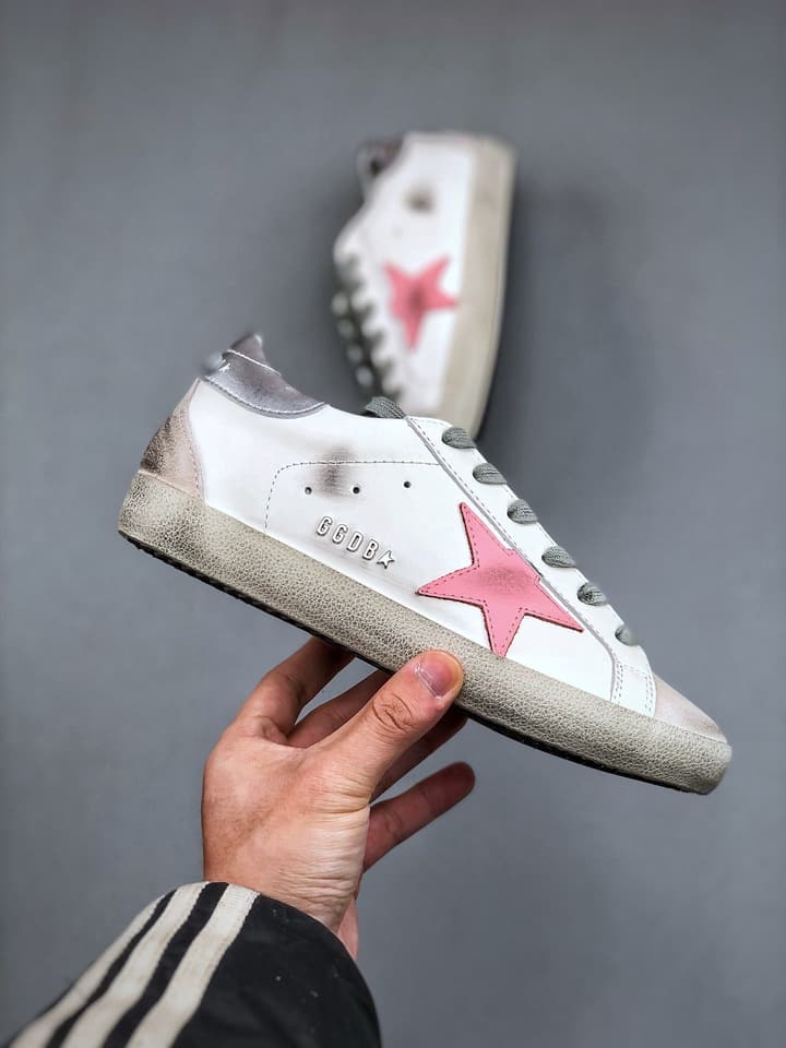 Golden Goose Distressed Sneakers in Gold
