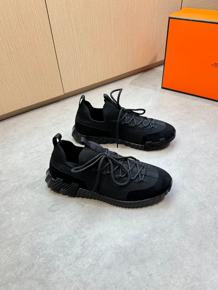 Hermès Casual Sports Sneakers in Black With White Laces And Orange Sole