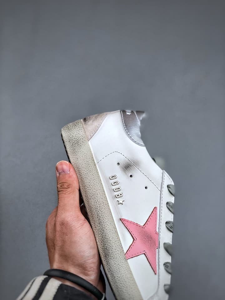 Golden Goose Distressed Sneakers in Gold
