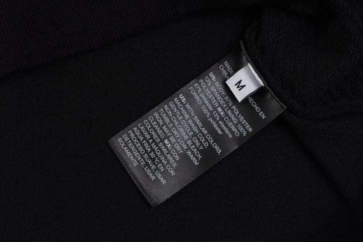 Hermès Retro Knitted Polo Shirt – SS24 in Black Polo With Orange Placket