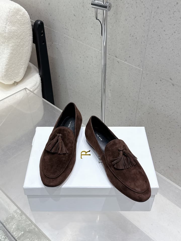 The Row Tassel Loafers in Black Suede