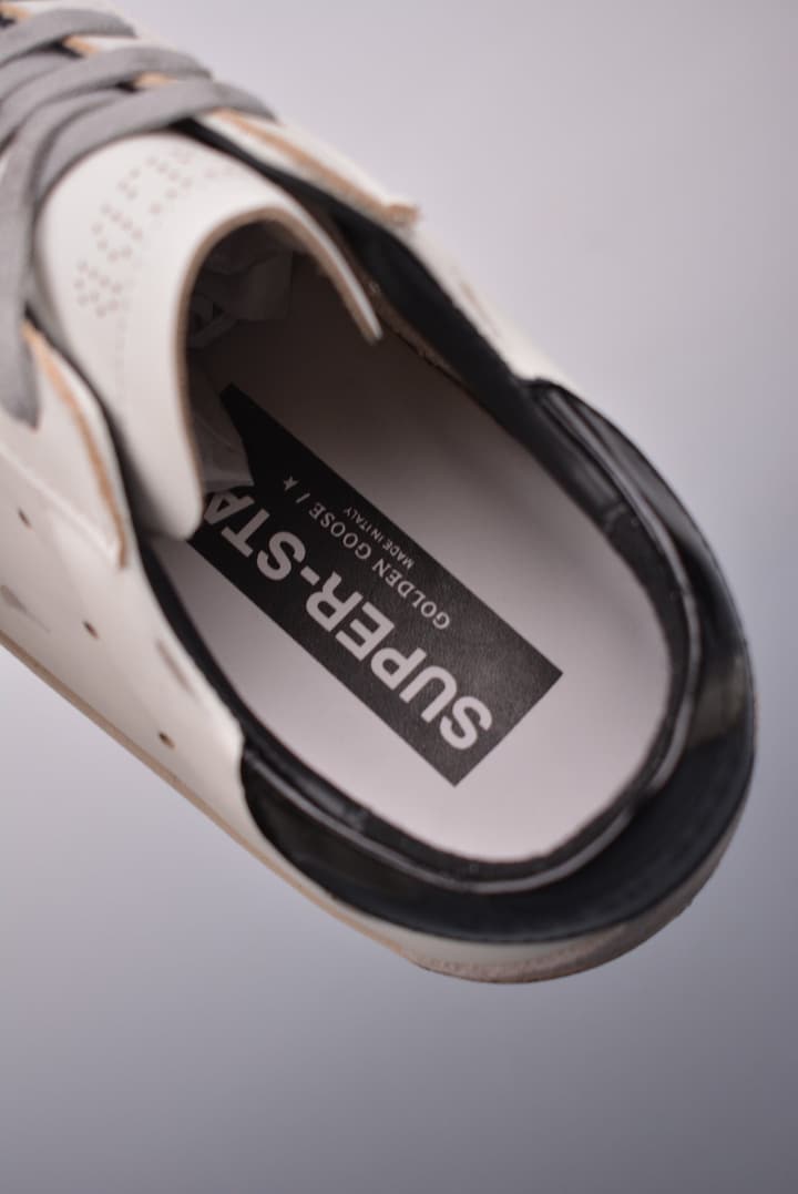 Golden Goose Super Star Distressed Sneakers – 2023 Collection in White With Navy Heel