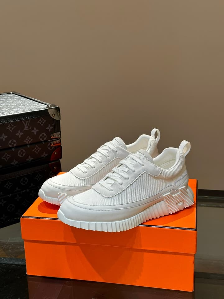 Hermès Bouncing Calfskin Mesh Sneakers in Black With White Stripe