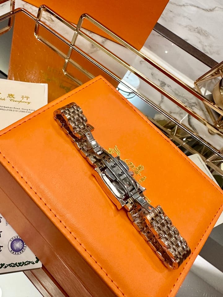 Hermès Small Square Luxury Watch in Dark Dial Patterned Gold Bracelet