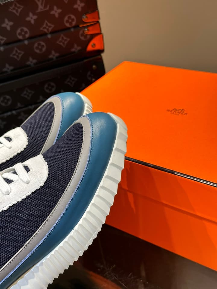 Hermès Bouncing Calfskin Mesh Sneakers in Black With White Stripe