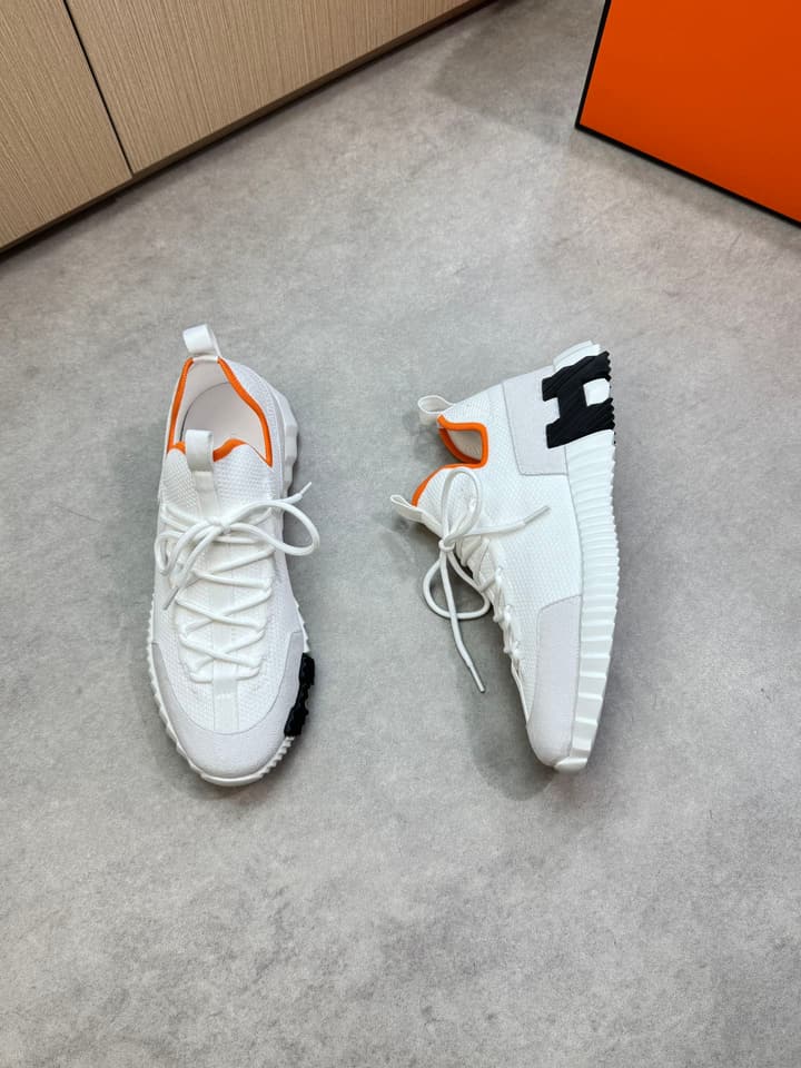 Hermès Casual Sports Sneakers in Black With White Laces And Orange Sole