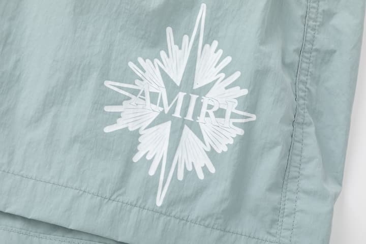 Amiri Logo Print Swim Trunks in Black