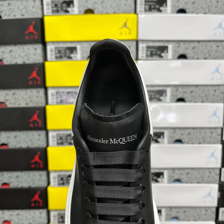 Alexander McQueen Oversized Low-Top Sneakers in All Black With White Sole