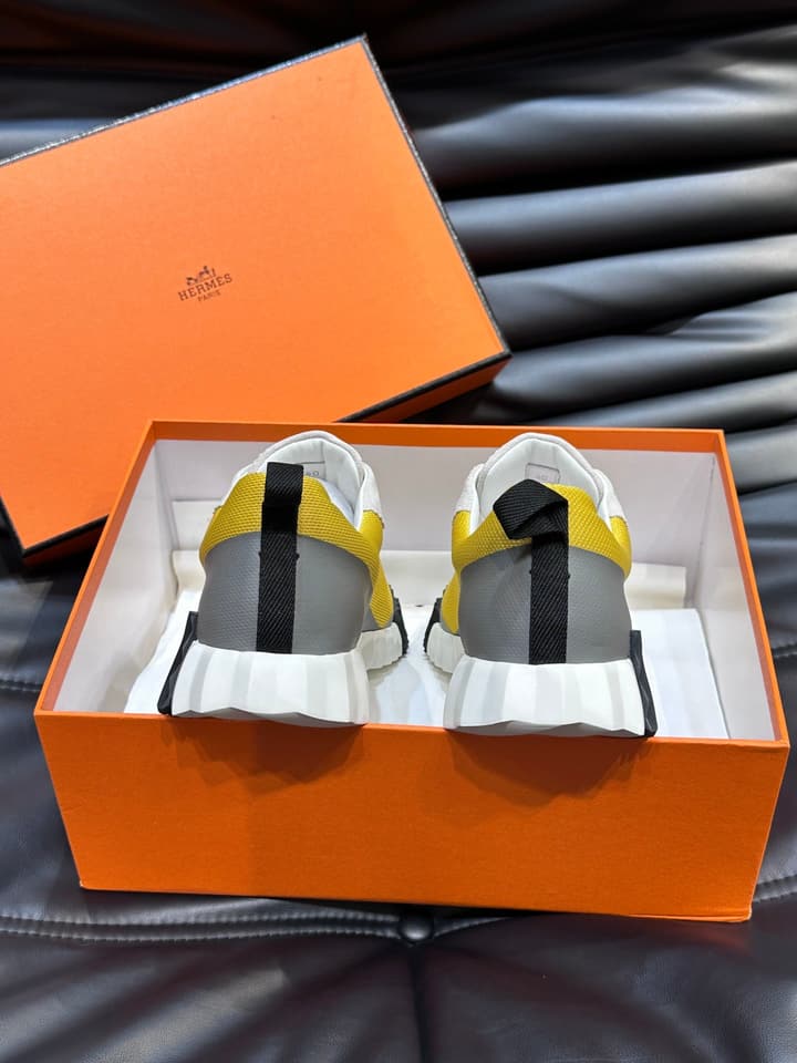 Hermès Bouncing Calfskin Mesh Sneakers in Black With White Stripe