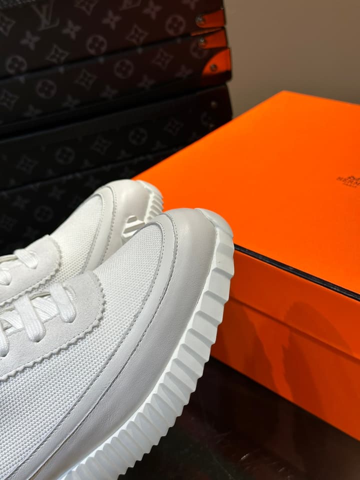 Hermès Bouncing Calfskin Mesh Sneakers in Black With White Stripe