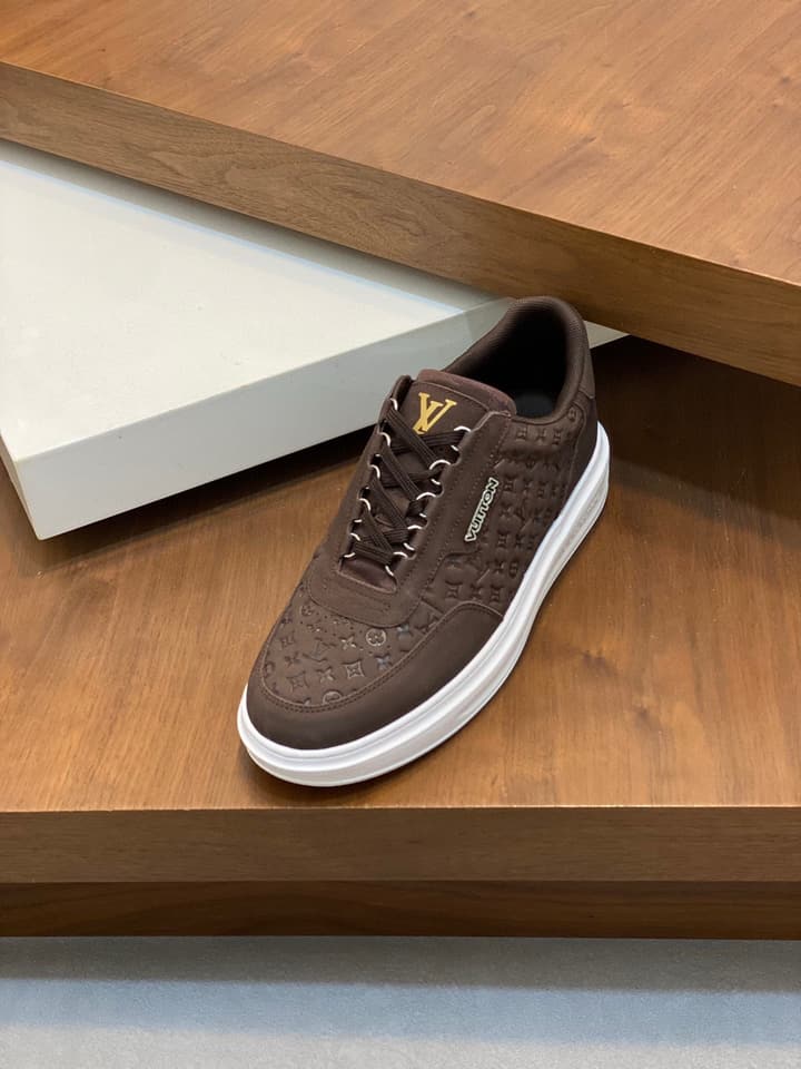 Louis Vuitton Embossed Calfskin Sneakers in Black