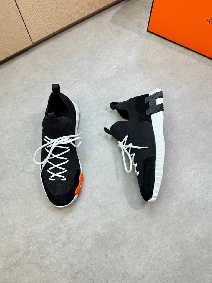 Hermès Casual Sports Sneakers in Black With White Laces And Orange Sole