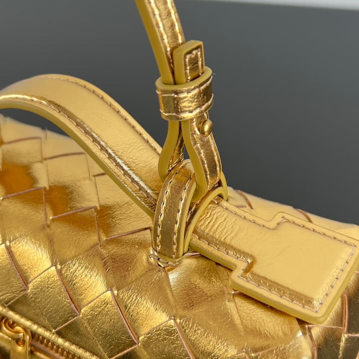 Bottega Veneta Intrecciato Vanity Case in Metallic Gold