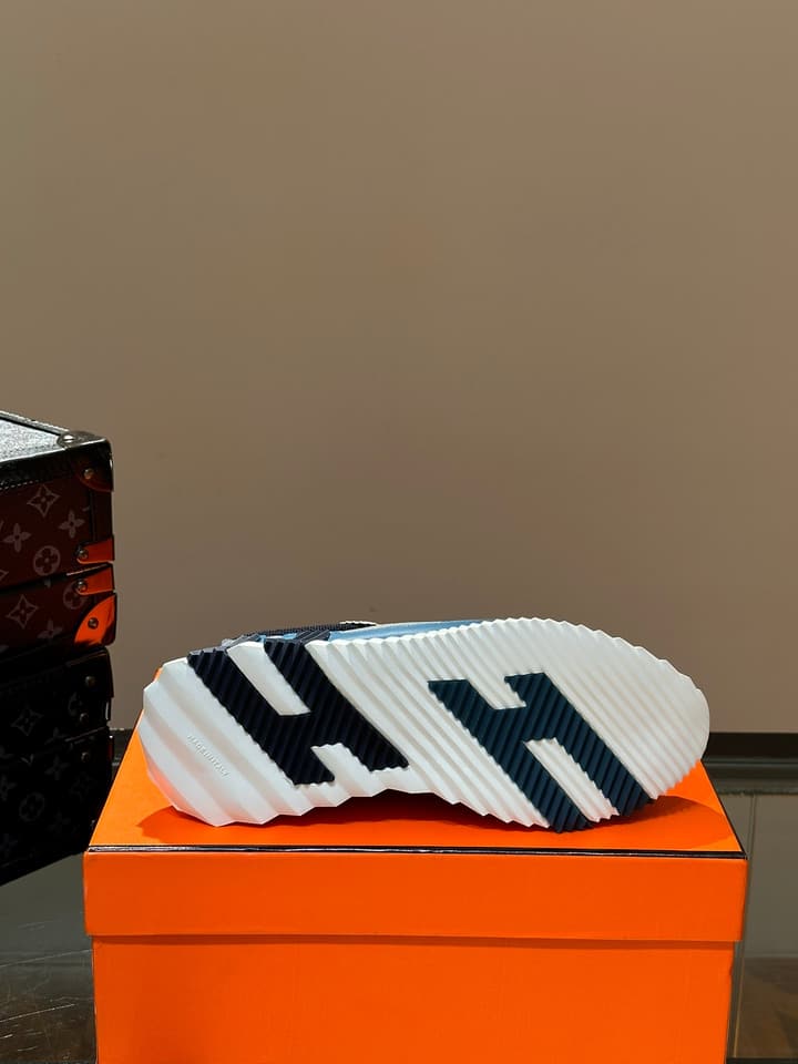 Hermès Bouncing Calfskin Mesh Sneakers in Black With White Stripe