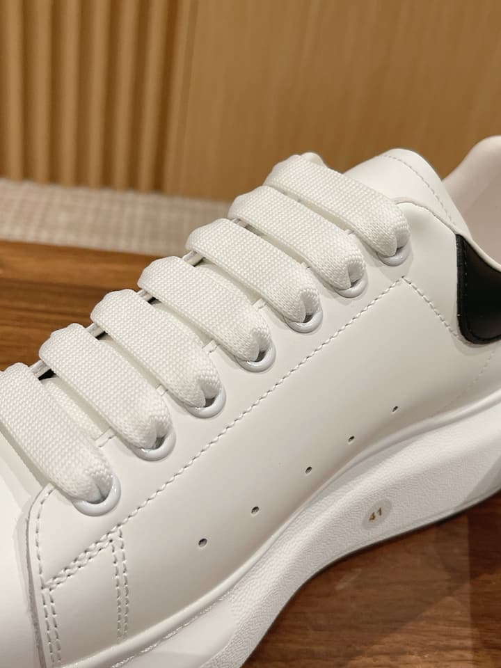 Alexander McQueen Classic Versatile White Sneakers in White With Black Laces & Heel