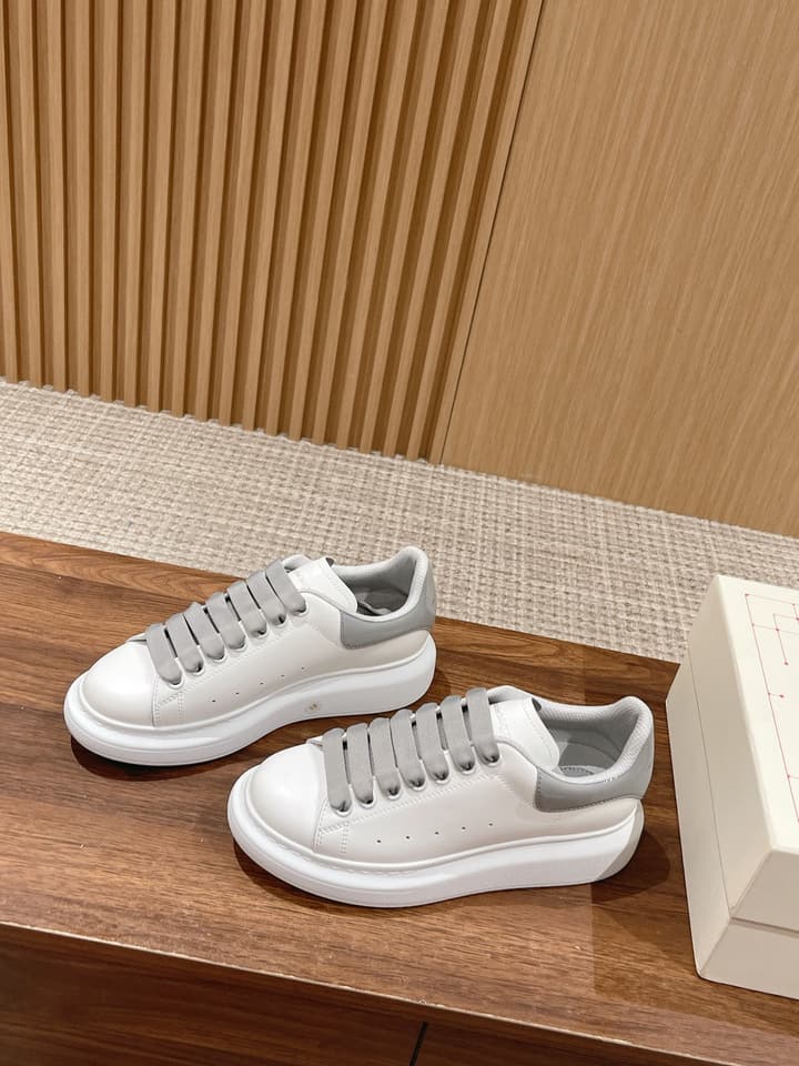 Alexander McQueen Classic Versatile White Sneakers in White With Black Laces & Heel