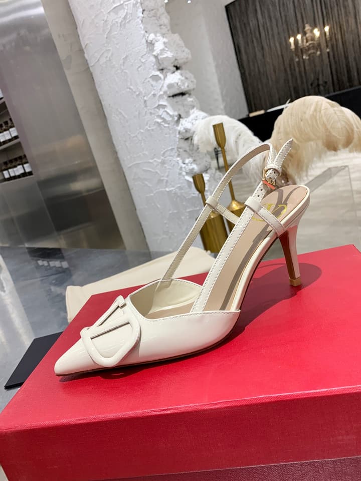 Valentino VLogo Pointed-Toe Patent Leather Pumps in Black Patent