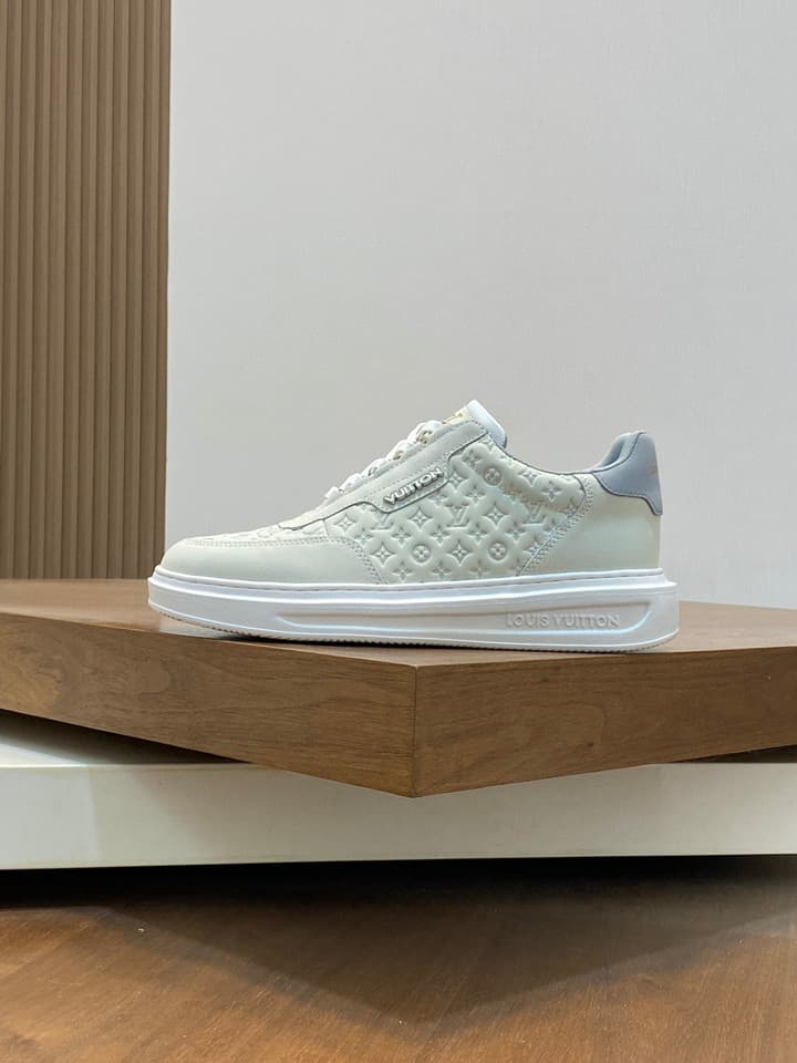 Louis Vuitton Embossed Calfskin Sneakers in Black