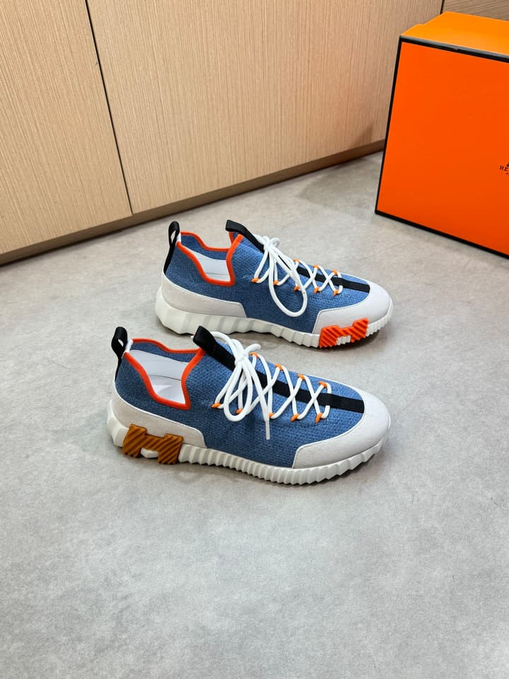 Hermès Casual Sports Sneakers in Black With White Laces And Orange Sole