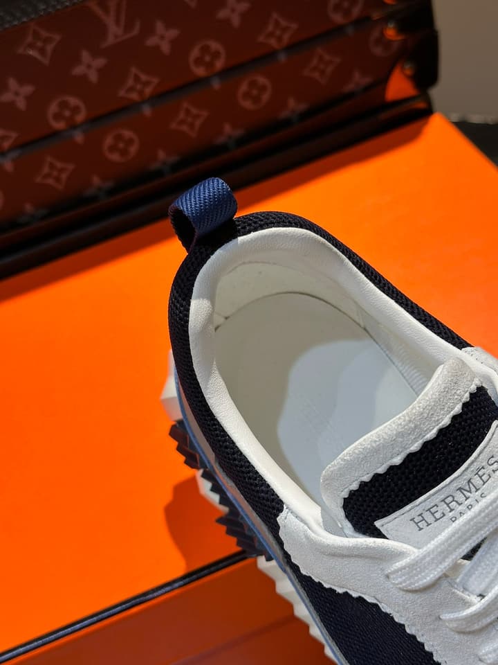 Hermès Bouncing Calfskin Mesh Sneakers in Black With White Stripe