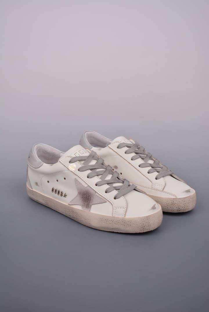 Golden Goose Super Star Distressed Sneakers – 2023 Collection in White With Navy Heel