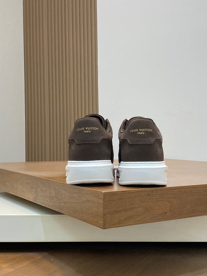 Louis Vuitton Embossed Calfskin Sneakers in Black