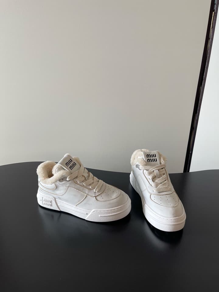 Miu Miu Distressed Retro German Training Sneakers in Distressed Off-white