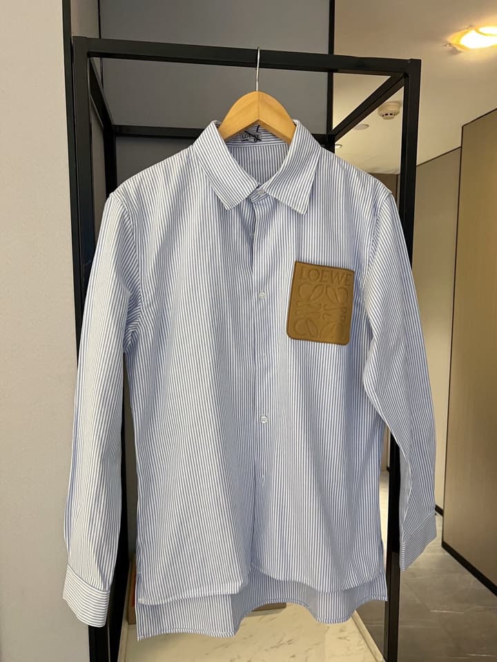 Loewe Embossed Logo Suede Pocket Striped Shirt in Tan Loewe Pouch, Light Blue Overshirt, Black Skirt - View 1