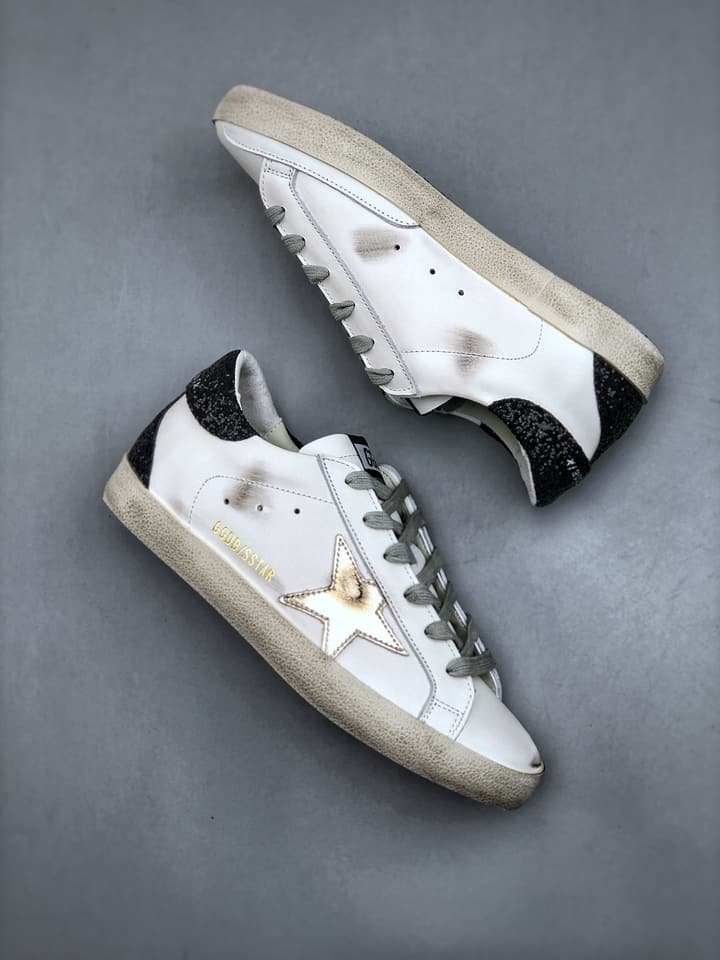 Golden Goose Distressed Sneakers in Gold