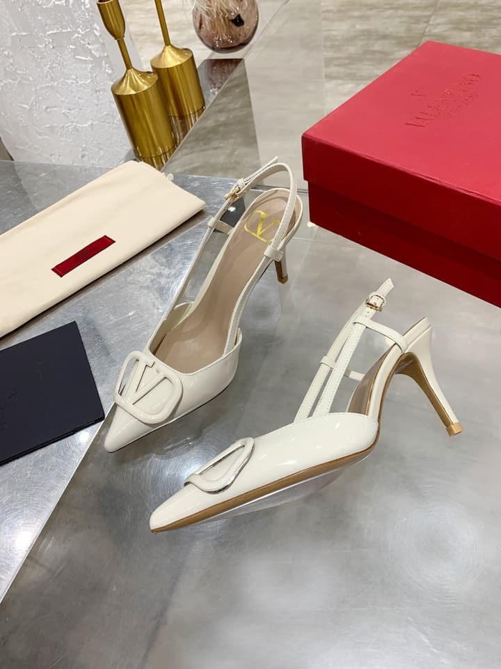 Valentino VLogo Pointed-Toe Patent Leather Pumps in Black Patent