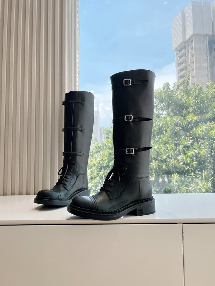 Miu Miu Distressed Biker Knee-High Boots – Autumn/Winter Runway Edition in Distressed Black Moto Boots