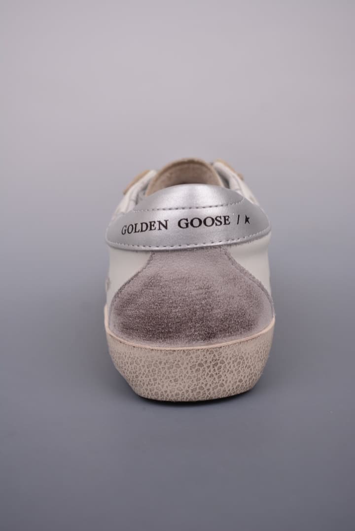 Golden Goose Super Star Distressed Sneakers – 2023 Collection in White With Navy Heel