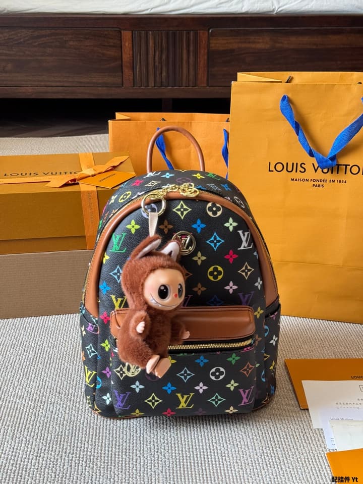 Louis Vuitton Monogram Mini Backpack in Monogram With Light Blue Charm