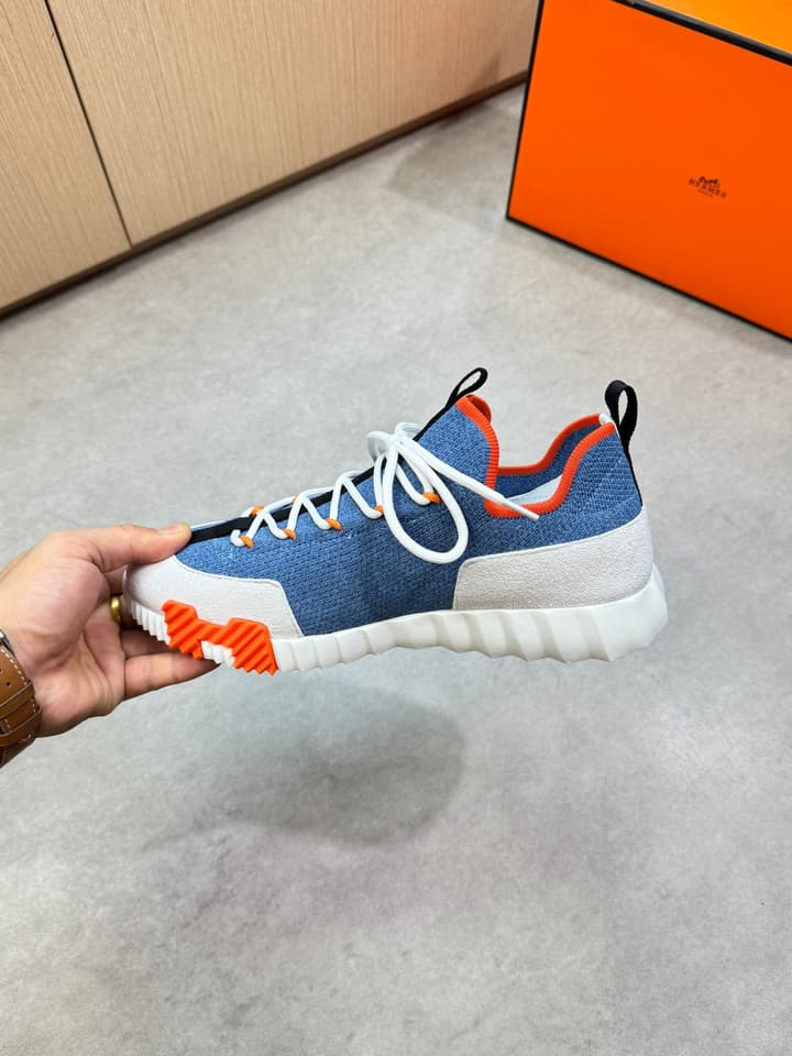 Hermès Casual Sports Sneakers in Black With White Laces And Orange Sole