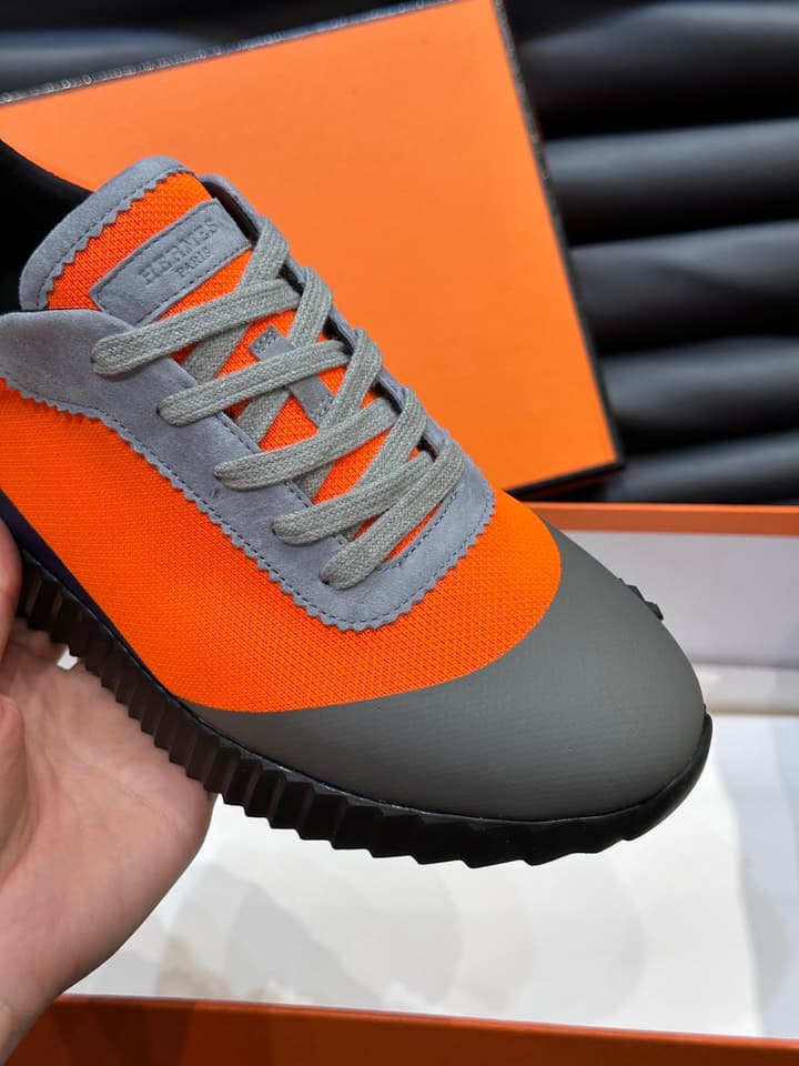 Hermès Bouncing Calfskin Mesh Sneakers in Black With White Stripe