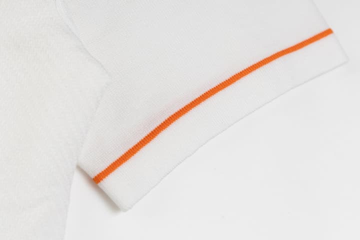 Hermès Retro Knitted Polo Shirt – SS24 in Black Polo With Orange Placket