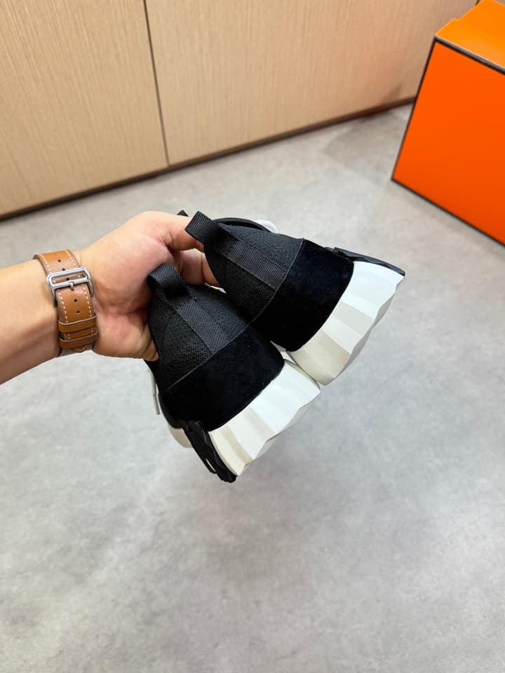 Hermès Casual Sports Sneakers in Black With White Laces And Orange Sole