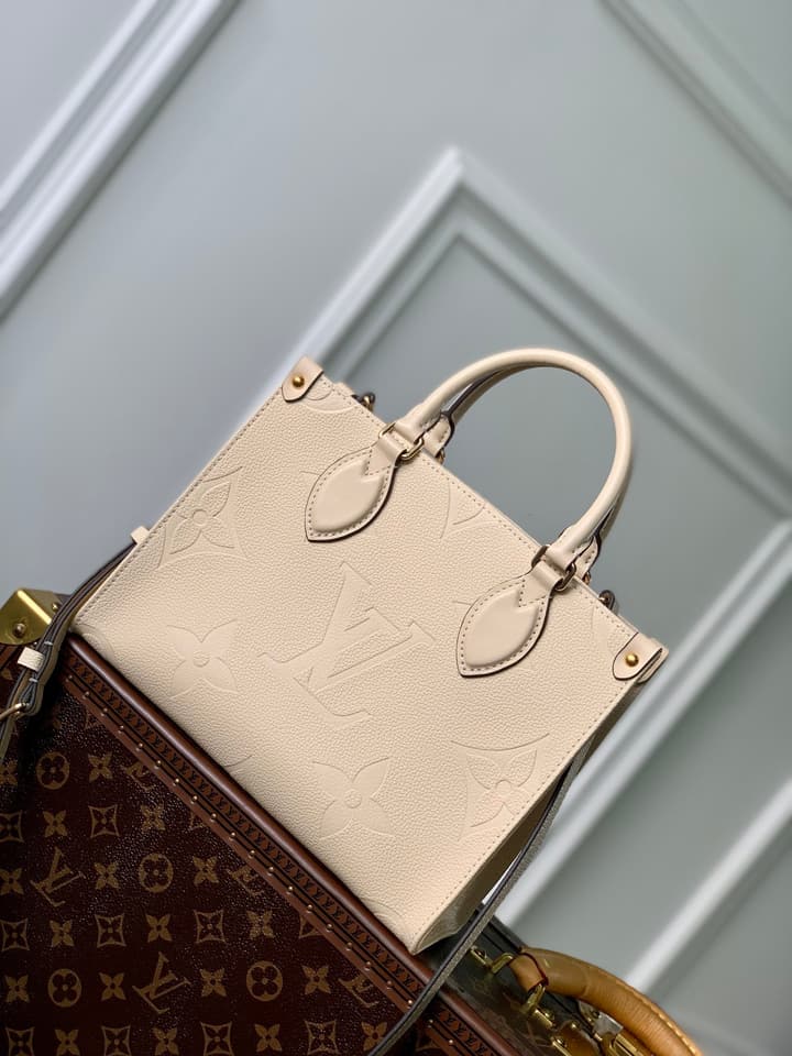 Louis Vuitton OnTheGo Small Tote Bag in Cream Empreinte With Monogram Sides