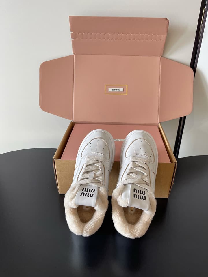 Miu Miu Distressed Retro German Training Sneakers in Distressed Off-white