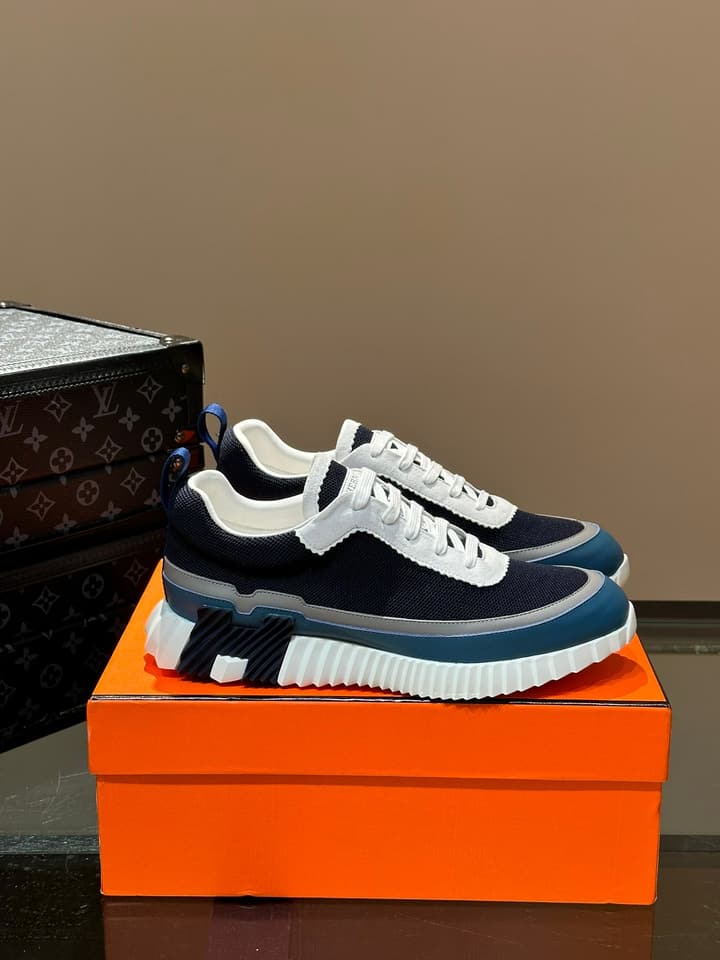 Hermès Bouncing Calfskin Mesh Sneakers in Black With White Stripe