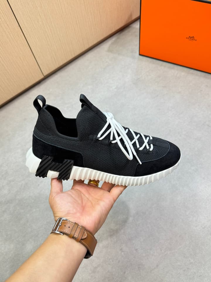 Hermès Casual Sports Sneakers in Black With White Laces And Orange Sole