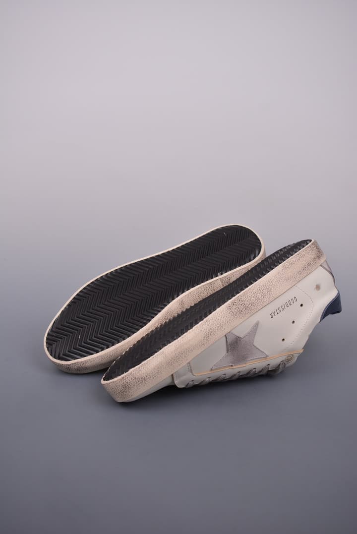 Golden Goose Super Star Distressed Sneakers – 2023 Collection in White With Navy Heel