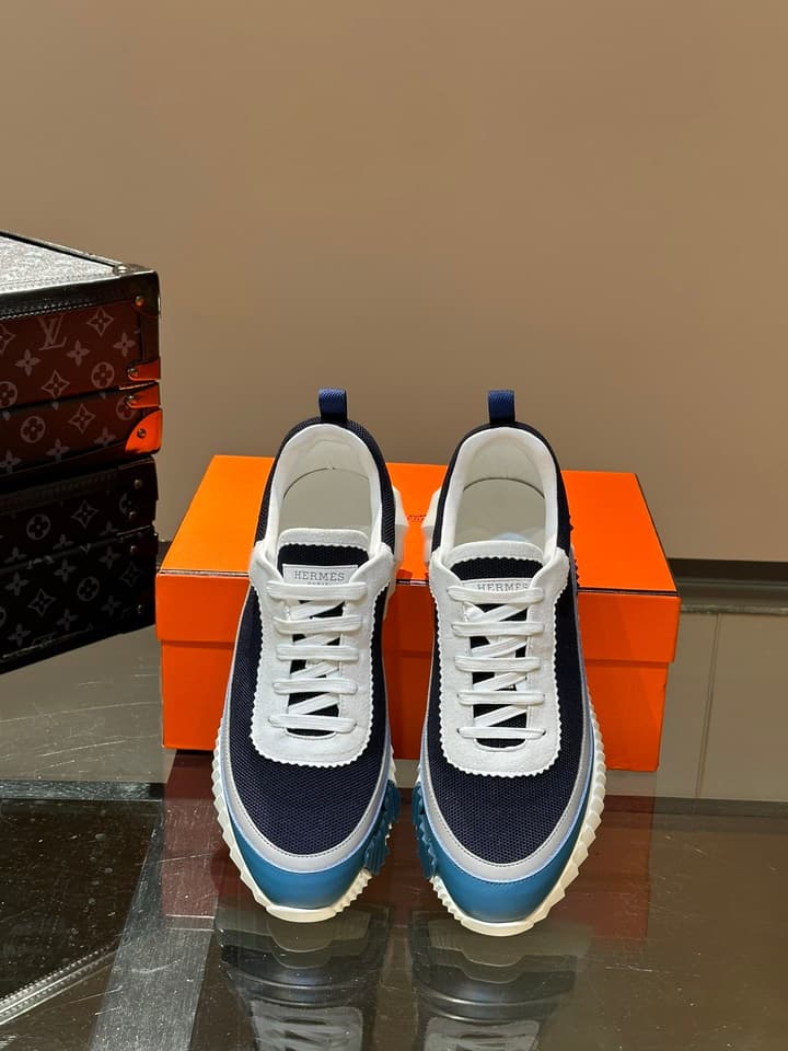 Hermès Bouncing Calfskin Mesh Sneakers in Black With White Stripe