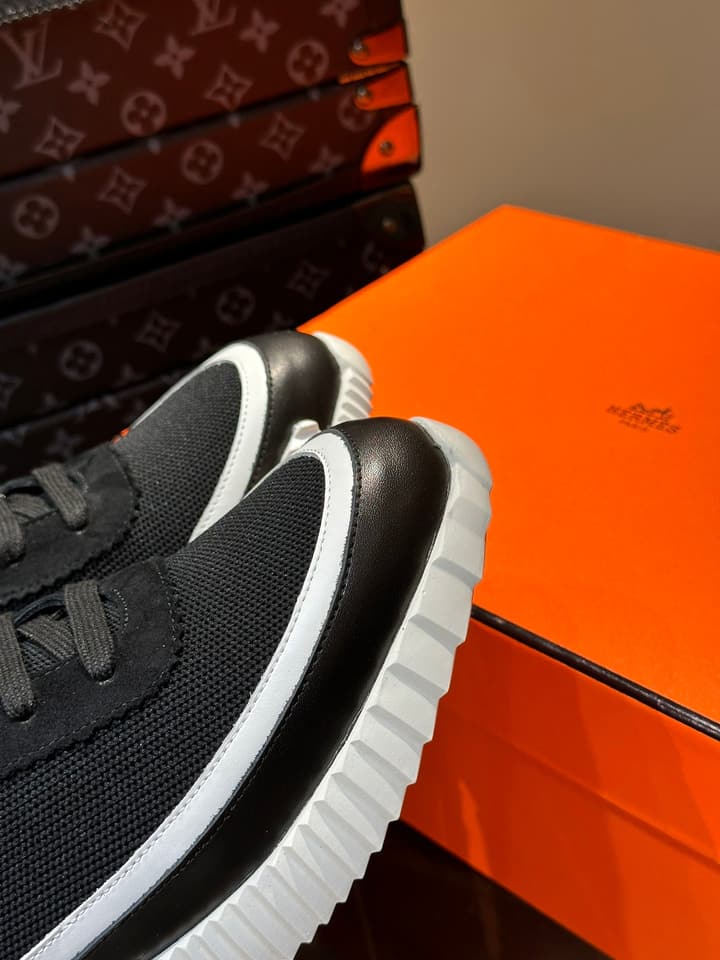 Hermès Bouncing Calfskin Mesh Sneakers in Black With White Stripe