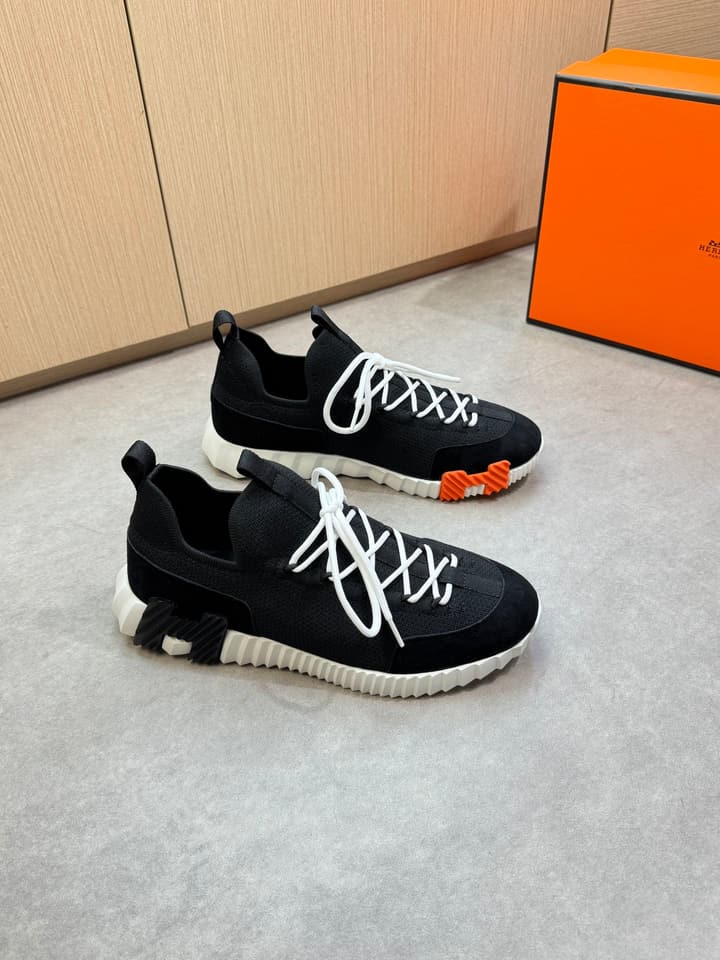 Hermès Casual Sports Sneakers in Black With White Laces And Orange Sole