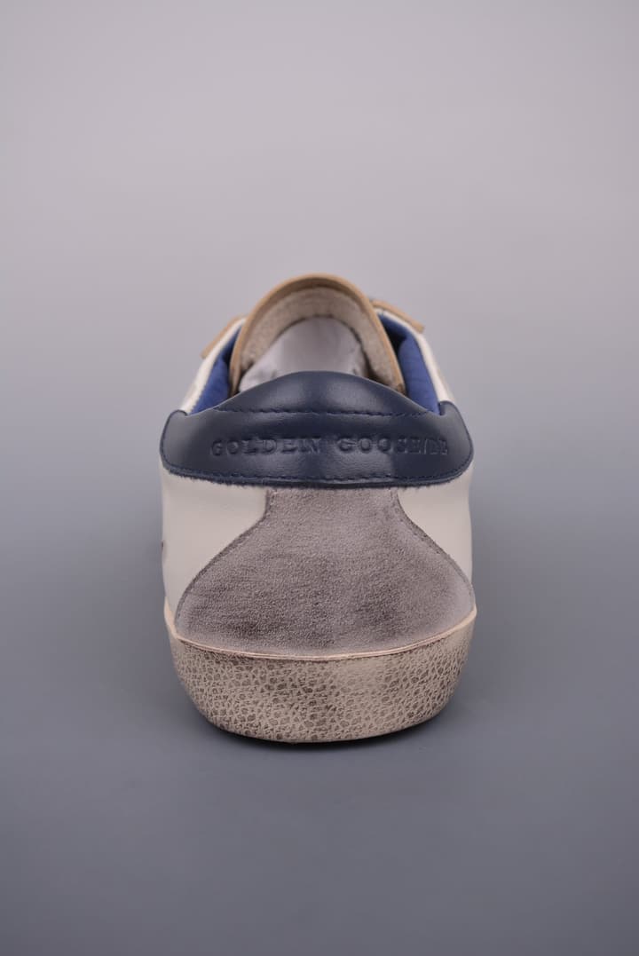 Golden Goose Super Star Distressed Sneakers – 2023 Collection in White With Navy Heel
